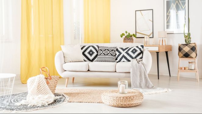 Stylish yellow curtains installed in living room