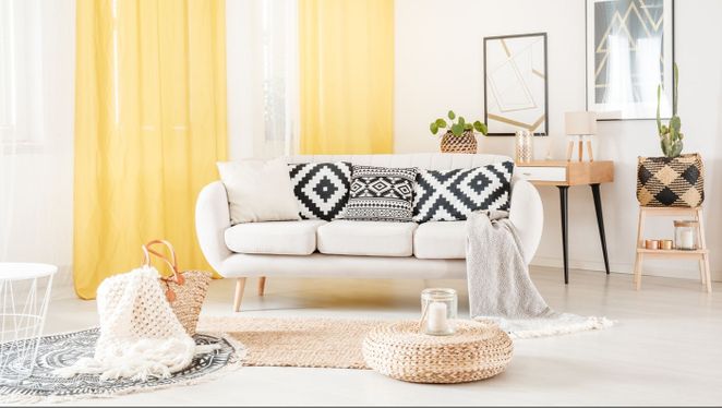 Stylish yellow curtains installed in living room